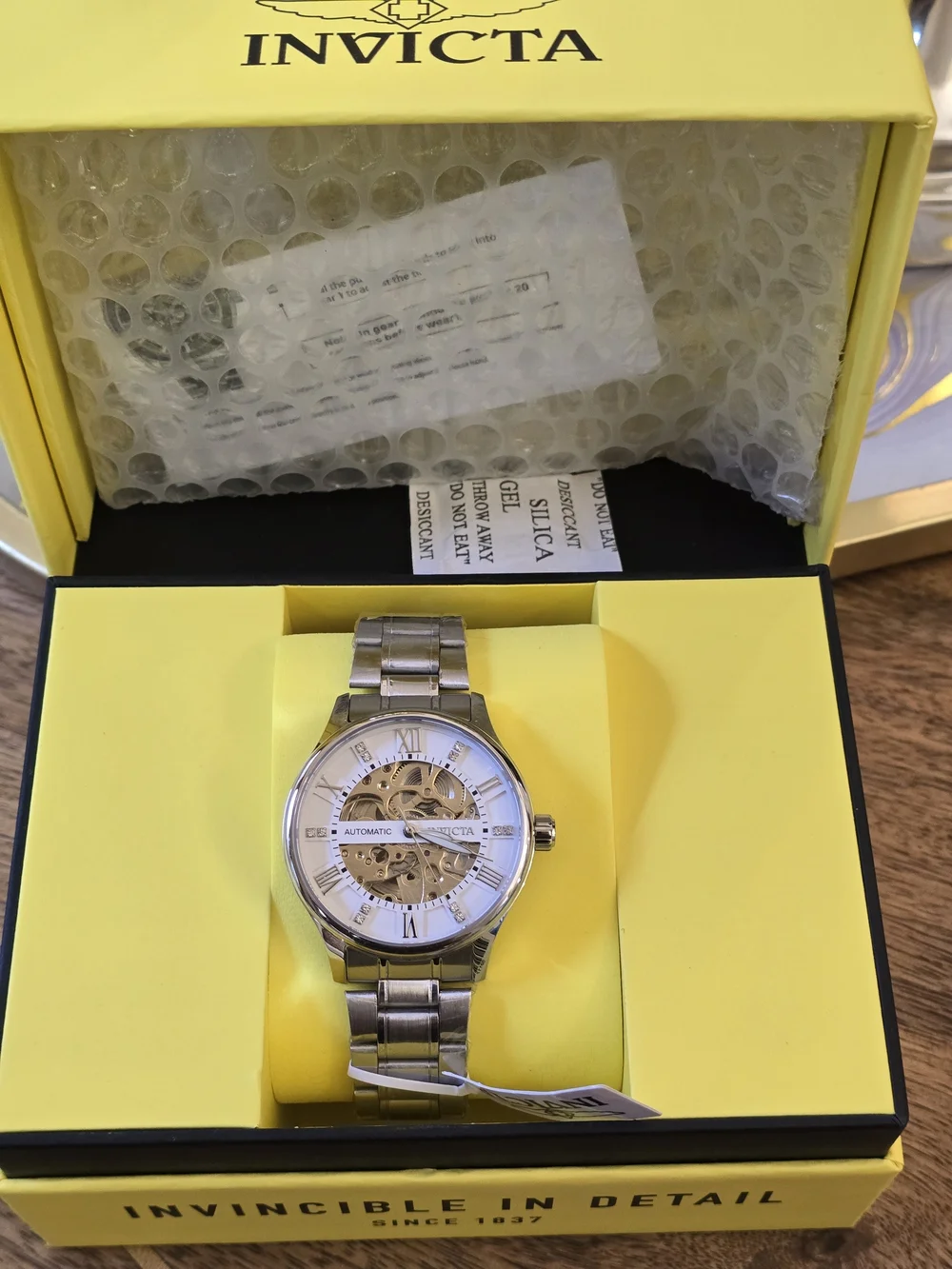 Invicta Men's Silver Skeleton Dial Automatic Watch with White Accents
